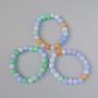 Bracciale Assortito (pressato) palline lisce, diametro 10 mm +/-, lunghezza 18 cm +/- (elastico)