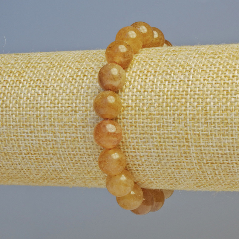 Bracciale in calcite con palline lisce, diametro 10 mm± (elasticizzato), lunghezza 18 cm+