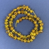 Perline di ambra sfaccettate 6×4 mm, con perline da 2 mm, su filo, lunghezza circa 39 cm