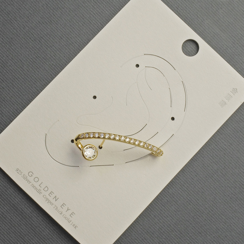 Orecchino a cuff dorato con strass bianchi 12×32 mm ±