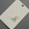 Orecchino clip-on per l'orecchio Fiocco in metallo argentato 17x30 mm +/- strass bianchi