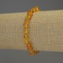 Bracciale in ambra levigata con perline da 7x5 mm ± e perline da 2 mm ±, lunghezza 18 cm ±, elastico