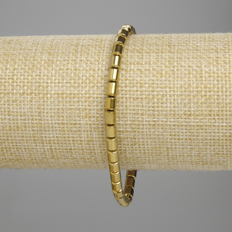 Bracciale ematite cilindro 5×4 mm ± colore dorato, lunghezza 18 cm ± elastico