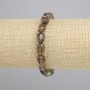 Bracciale in topazio fumé, sfaccettato, diametro 9-12×7,5 mm, 5-8,5 mm ±, lunghezza 18 cm ±, elastico