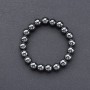 Bracciale in ematite con palline lisce su elastico, diametro 8 mm