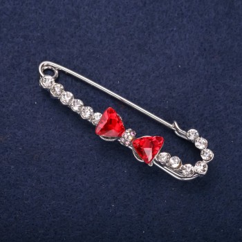 Spilla a fiocco con strass bianchi, pietre rosse, 64×18 mm, metallo argentato
