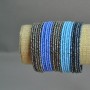 Braccialetto in perline con chiusura a clip viola-blu-grigio