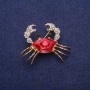 Spilla a forma di granchio con smalto rosso e strass, metallo dorato 30×40 mm