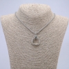 Pendente-anello 24x5 mm su catena, lunghezza 70 cm ±, metallo argentato
