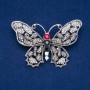 Spilla Farfalla, metallo argentato, strass grigi, bianchi e rossi, 50×70 mm +