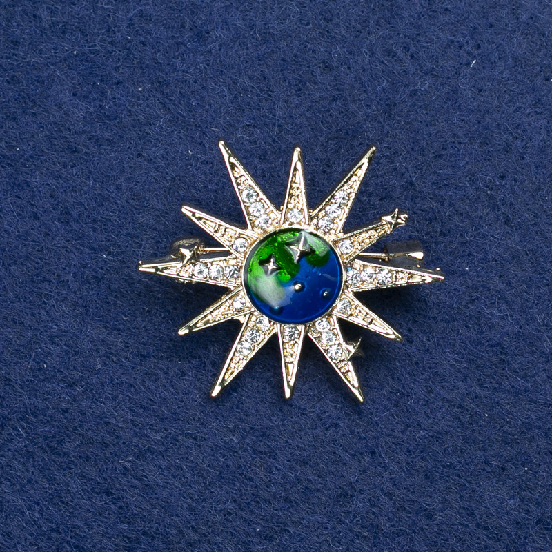 Spilla «Stella» metallo dorato, smalto e strass 32 mm +