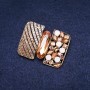 Spilla «Accento Ordine della Bellezza» con strass gialli e metallo dorato 34×45 mm