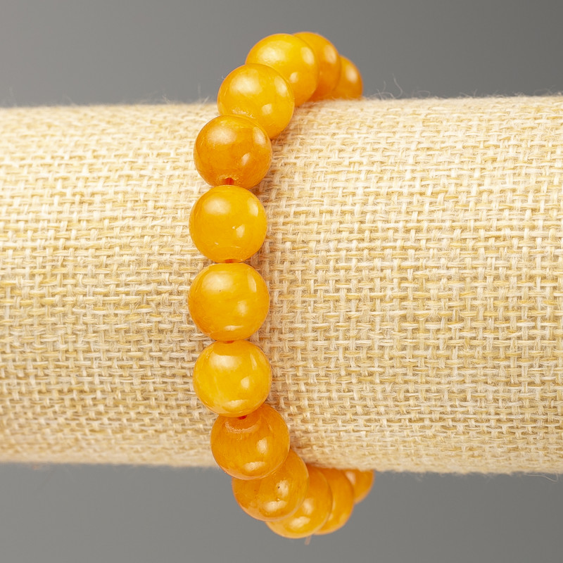 Bracciale elastico in ambra artificiale, perle lisce, diametro 10 mm +-, lunghezza 18 cm+