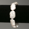 Bracciale di perle barocche in tonalità «benzina», diametro 14x23 mm, lunghezza 18 cm +/- (elastico)
