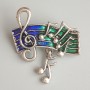 Spilla «Note» verde e blu smalto, metallo argentato 33×26 mm